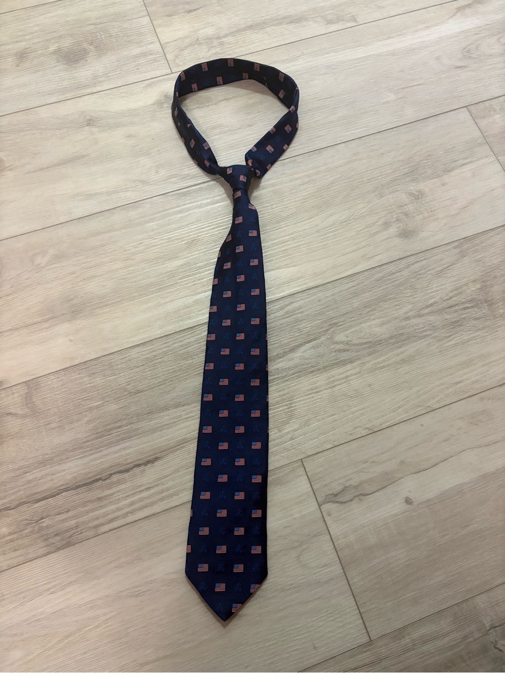 Brooks Brothers Navy Silk Tie with Red Flag Motif